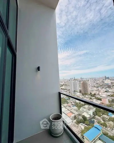 Stunning high-rise balcony with panoramic city views, perfect for urban living.