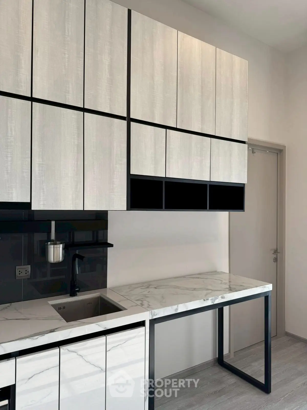 Modern kitchen with sleek cabinetry and marble countertops