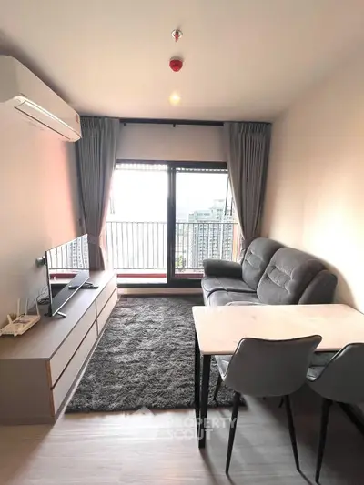 Modern living room with balcony view in high-rise apartment