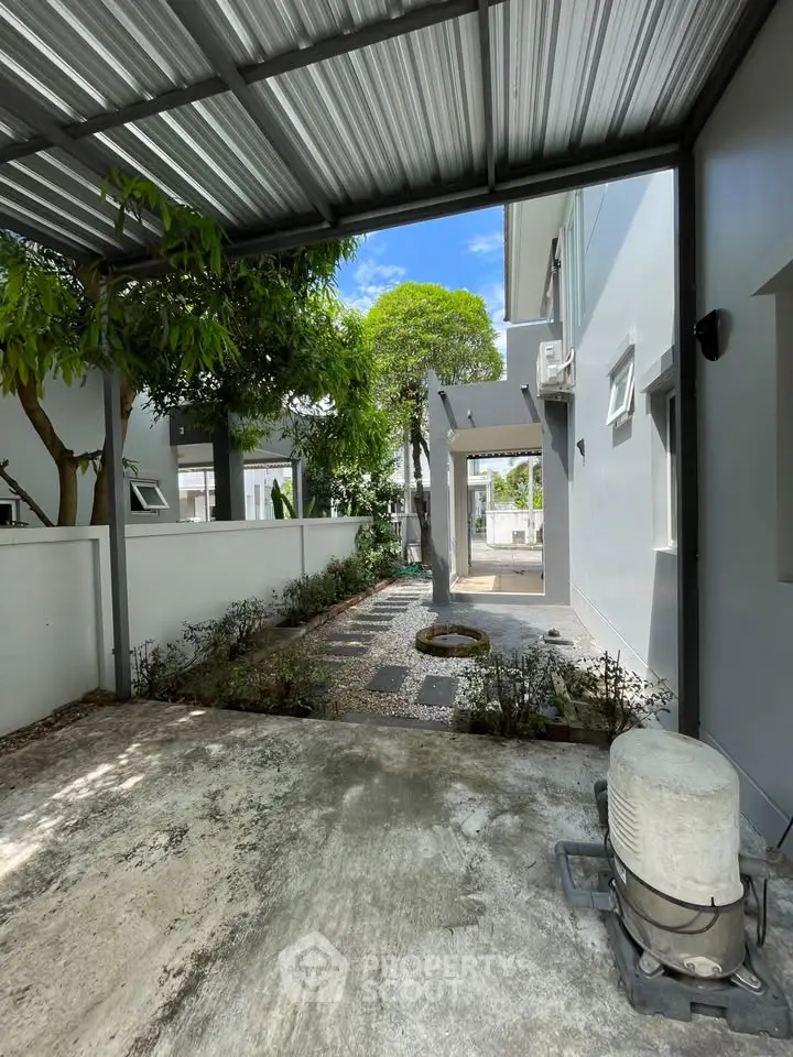 Charming garden view with modern exterior and lush greenery