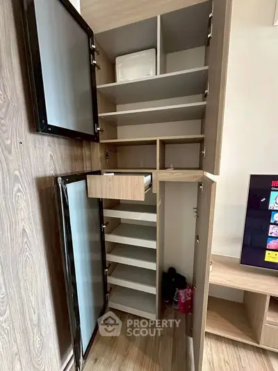Spacious modern storage cabinet with multiple shelves and sleek design in a stylish living room.