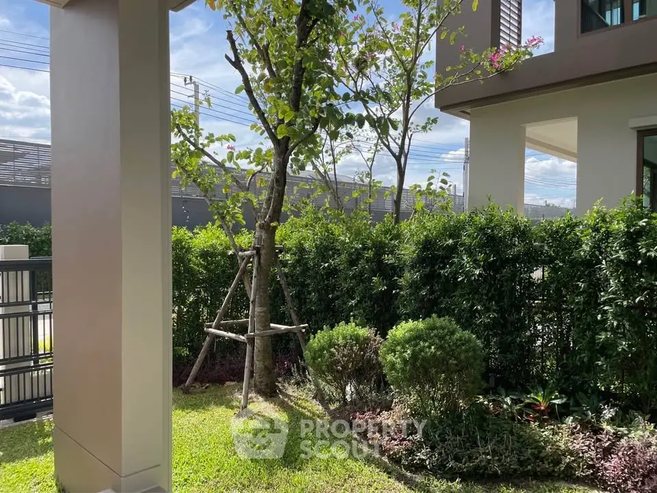 Charming garden view with lush greenery and modern architecture