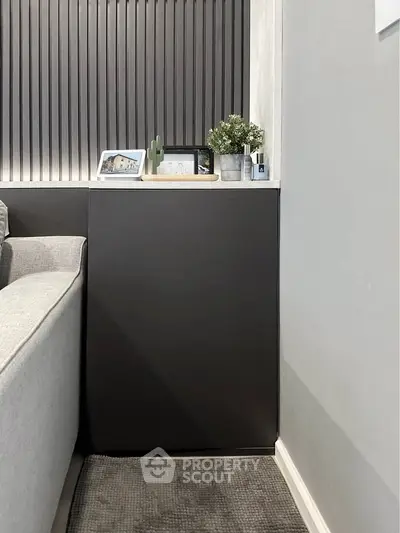 Modern living room corner with sleek decor and stylish paneling