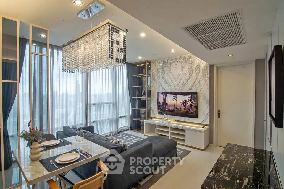 Luxurious modern living room with elegant chandelier and stylish decor