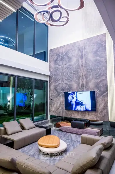 Luxurious modern living room with high ceilings and elegant decor