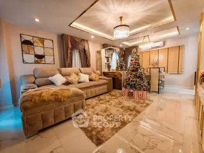 Luxurious living room with elegant decor and Christmas tree, perfect for holiday gatherings.