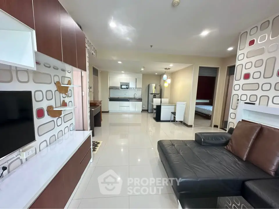 Spacious modern living room with open kitchen and stylish decor