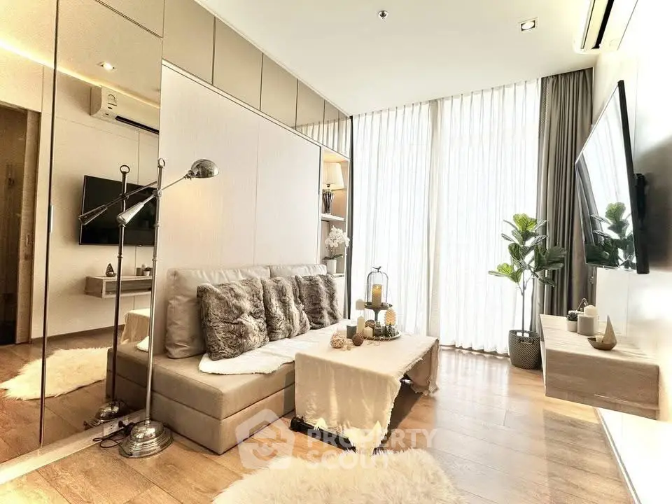 Luxurious living room with modern decor, plush seating, and floor-to-ceiling windows for natural light.