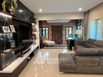 Luxurious living room with modern decor and large windows offering natural light