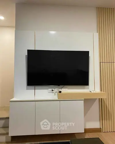 Modern living room with sleek TV unit and minimalist design