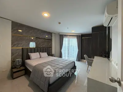 Luxurious modern bedroom with elegant decor and large window view