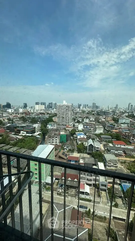 Stunning cityscape view from high-rise balcony showcasing urban skyline and vibrant neighborhood.
