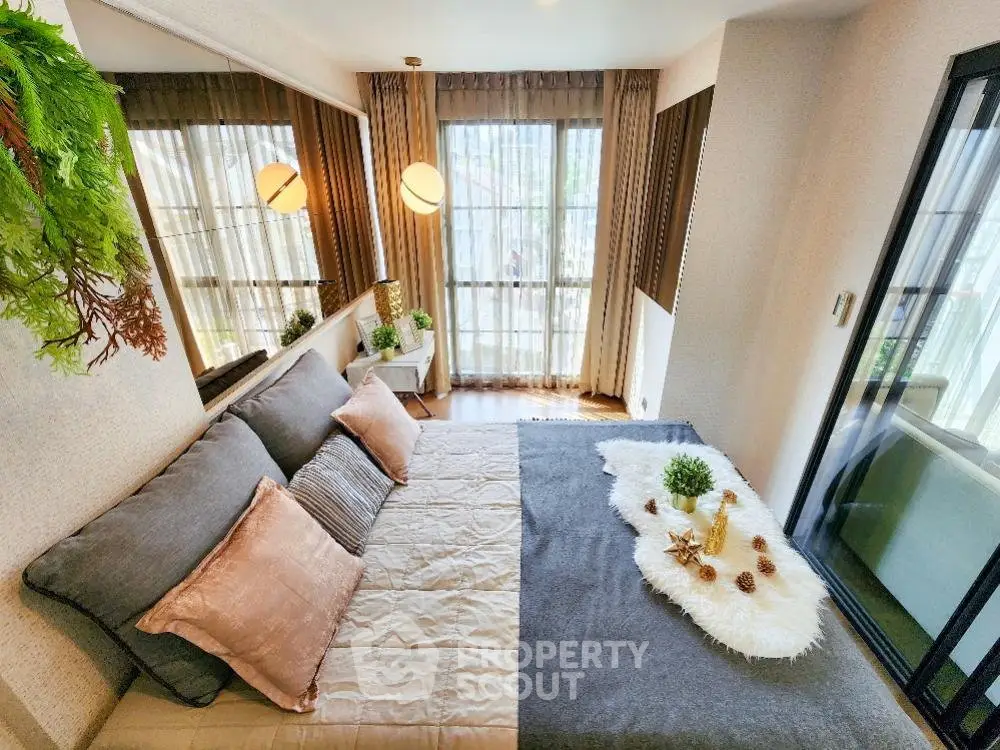 Luxurious bedroom with elegant decor and large windows offering natural light
