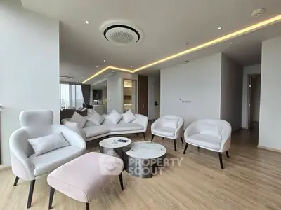 Spacious modern living room with elegant furniture and wooden flooring