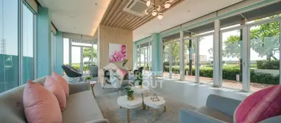 Spacious modern living room with large windows and garden view