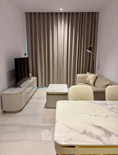 Modern living room with elegant marble table and cozy sofa, perfect for stylish urban living.