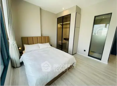 Modern bedroom with large windows and sleek wardrobe design