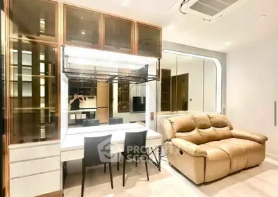 Modern living room with stylish furniture and mirrored wall accents