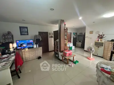 Spacious living area with modern decor and open layout, perfect for family gatherings.