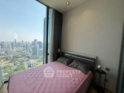 Luxurious bedroom with stunning city view in high-rise apartment