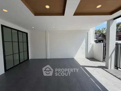 Spacious modern patio with sleek design and ample natural light, perfect for outdoor relaxation and entertainment.