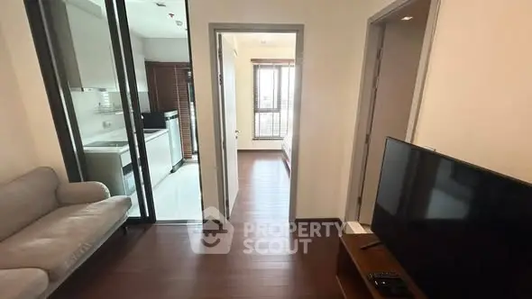 Modern apartment interior with cozy living room and kitchen view