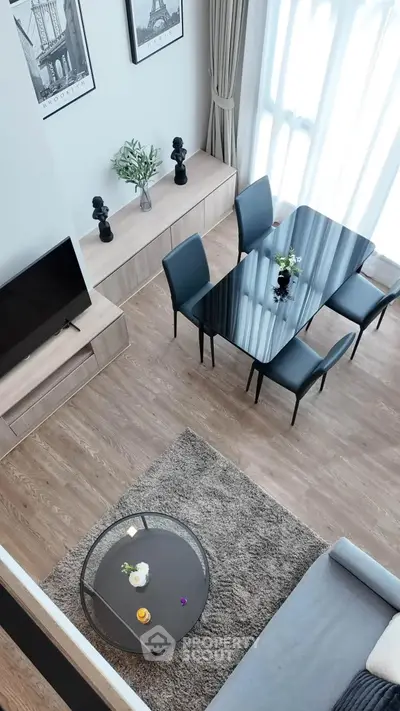 Modern living room with elegant dining area and stylish decor