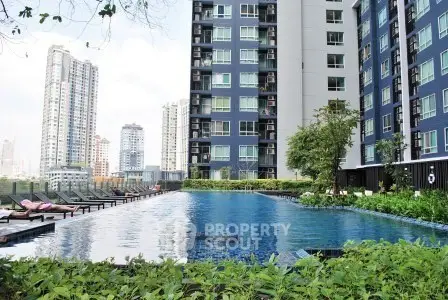 Luxurious high-rise apartment with stunning pool and city view, perfect for urban living.