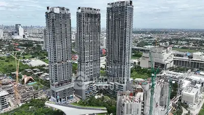 Stunning aerial view of modern high-rise buildings in a bustling urban landscape.