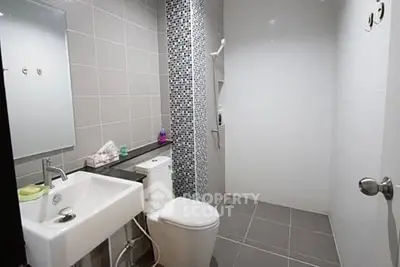 Modern bathroom with sleek tiles and contemporary fixtures