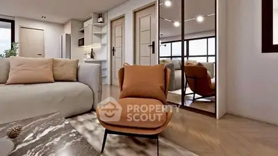 Modern living room with stylish furniture and open kitchen layout, featuring elegant decor and natural lighting.
