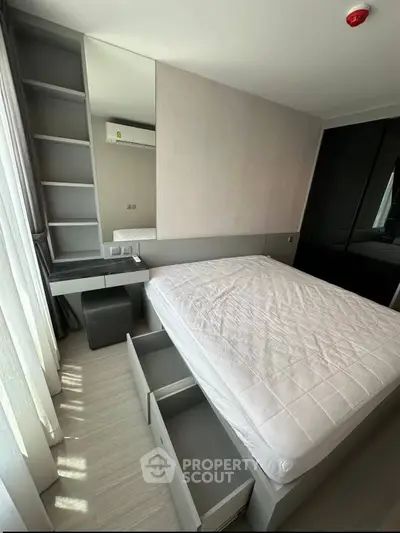 Modern bedroom with built-in storage and sleek design in a contemporary apartment.