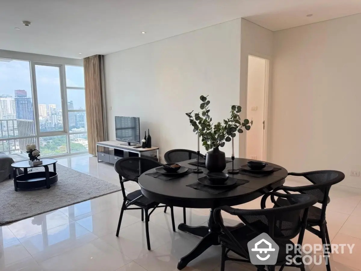 Modern living room with city view and elegant dining area