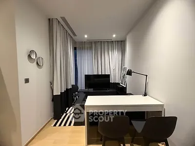 Modern living room with sleek furniture and stylish decor in a cozy apartment.