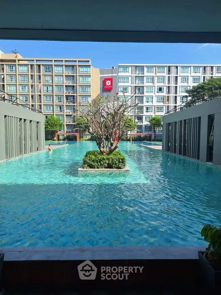 Luxurious apartment complex with stunning pool and modern architecture, perfect for upscale living.