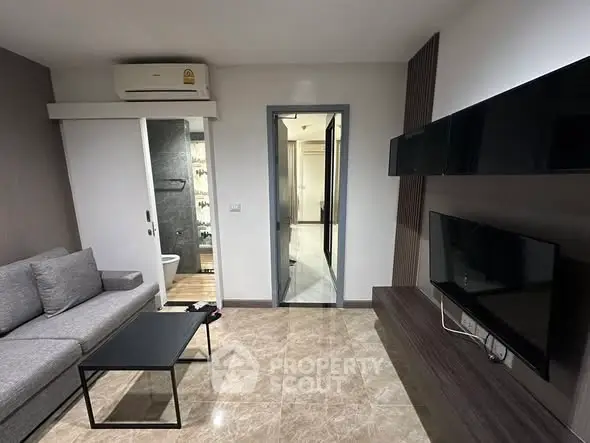 Modern living room with sleek design and wall-mounted TV