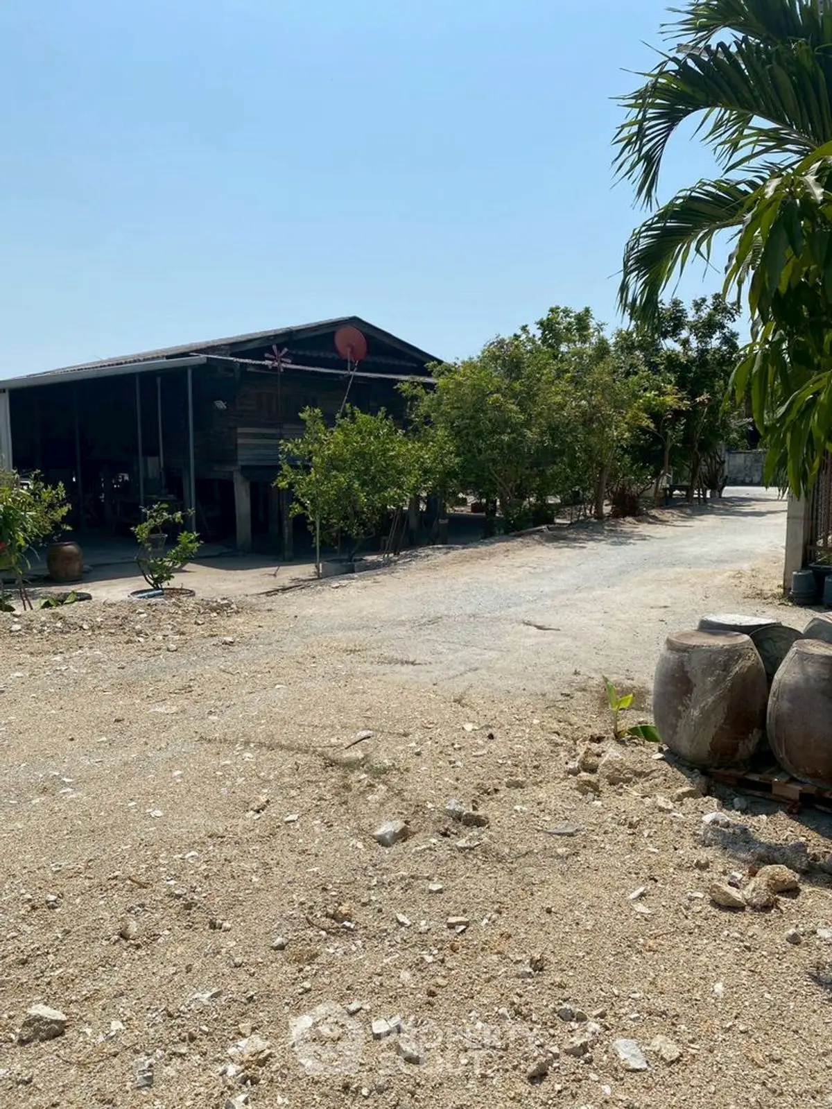 Charming rural property with spacious grounds and lush greenery, perfect for serene living.