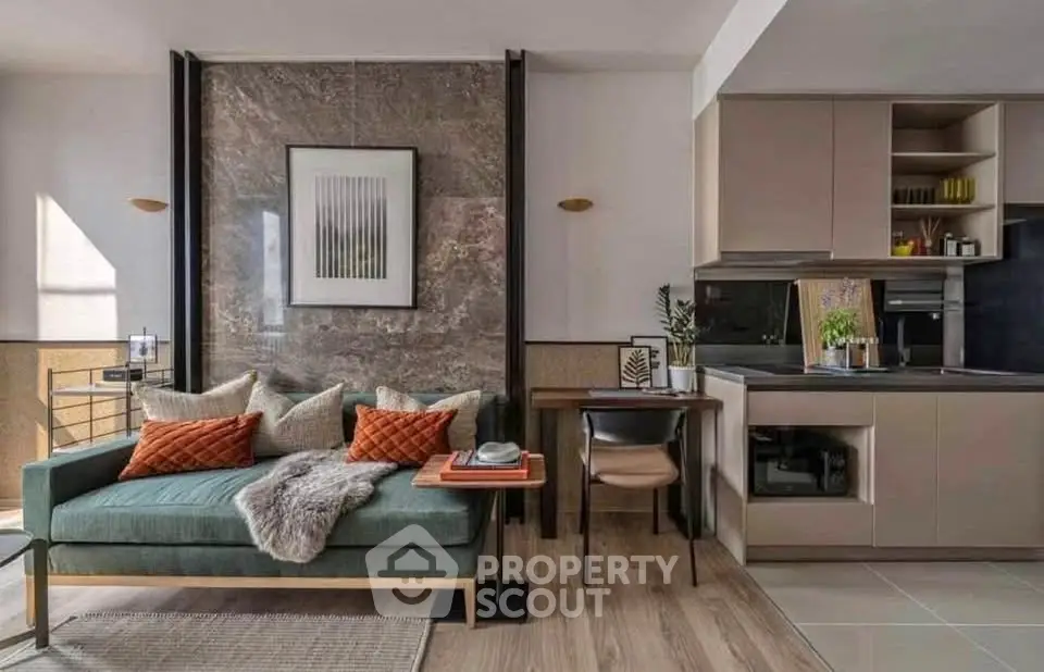 Modern open-plan living room and kitchen with stylish decor and natural light.