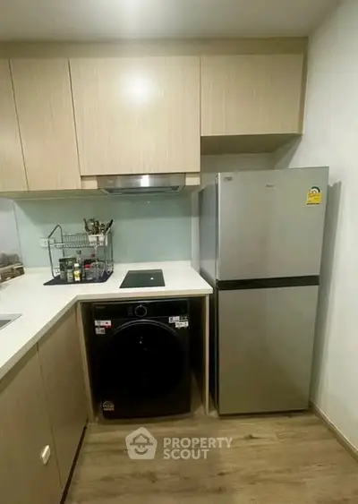 Modern kitchen with sleek appliances and ample storage space