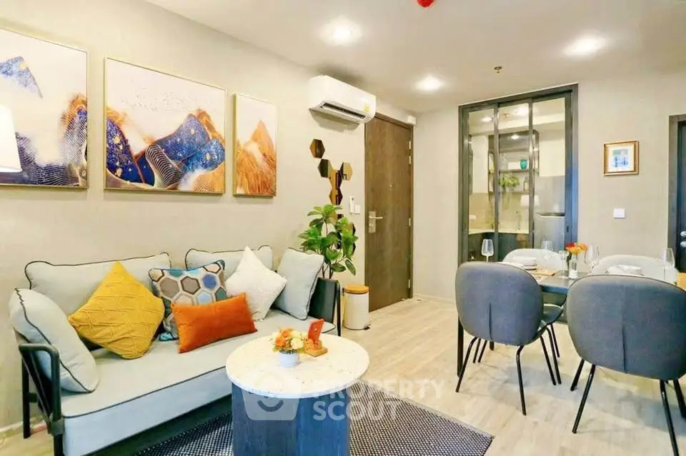 Modern living room with stylish decor and open dining area