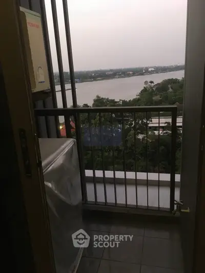 Charming balcony with stunning river view, perfect for relaxation and enjoying nature.