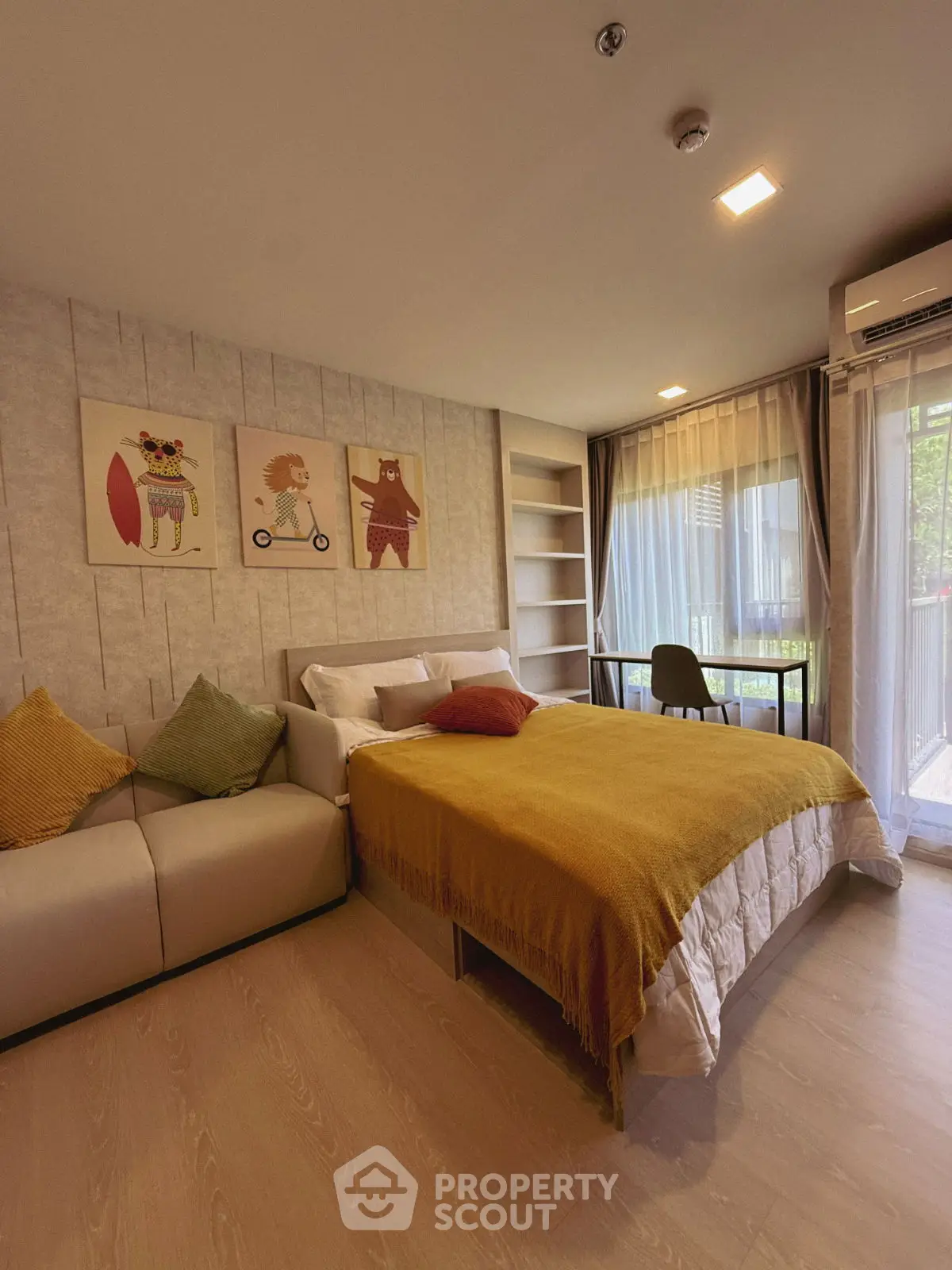 Cozy bedroom with modern decor, featuring a comfortable bed, stylish sofa, and large window for natural light.