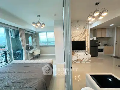 Modern open-plan apartment with stylish living room and bedroom, featuring marble accents and city views.