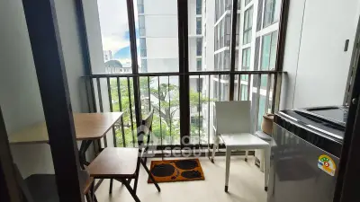 Charming balcony with city view, perfect for relaxing and enjoying the urban landscape.