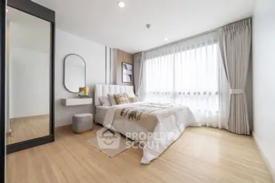Modern bedroom with large window and stylish decor