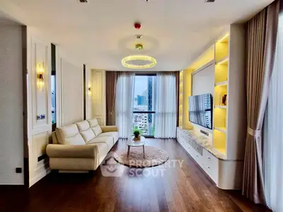 Luxurious living room with elegant decor and city view, featuring a plush sofa and modern entertainment center.