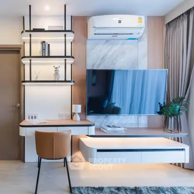 Modern living room with sleek TV setup and stylish desk area, featuring contemporary decor and air conditioning.