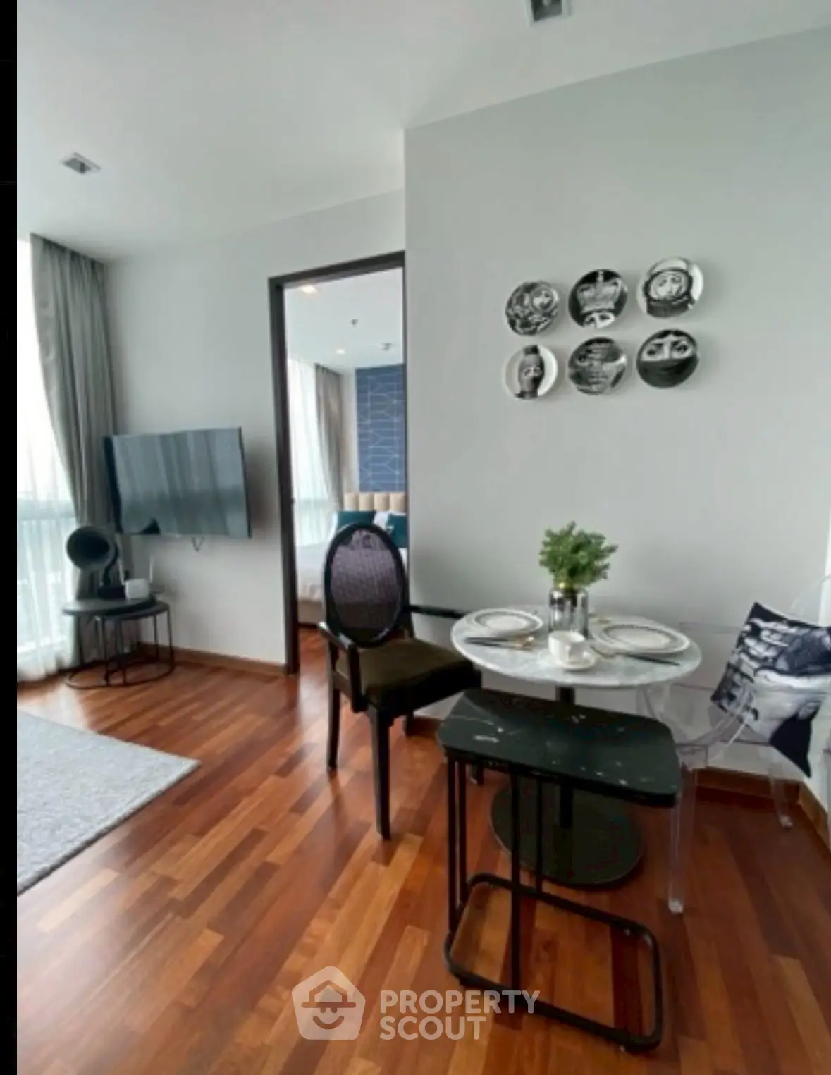 Chic modern living room with stylish decor and wooden flooring
