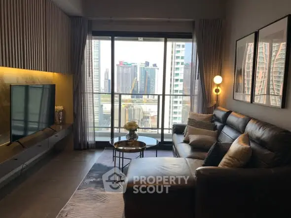 Modern living room with city view, featuring stylish decor and comfortable seating.