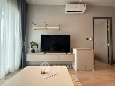 Modern living room with sleek TV unit and air conditioning, perfect for comfortable living.